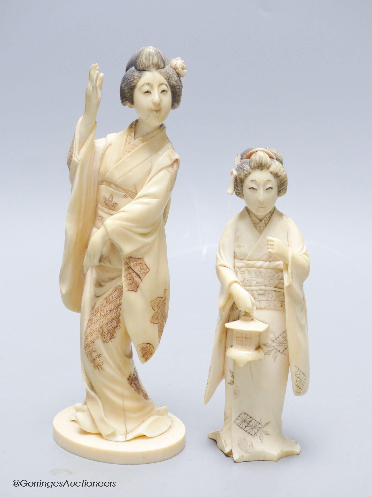 Two Japanese ivory figures of bijin, early 20th century, one signed to the base, height 17.5cm